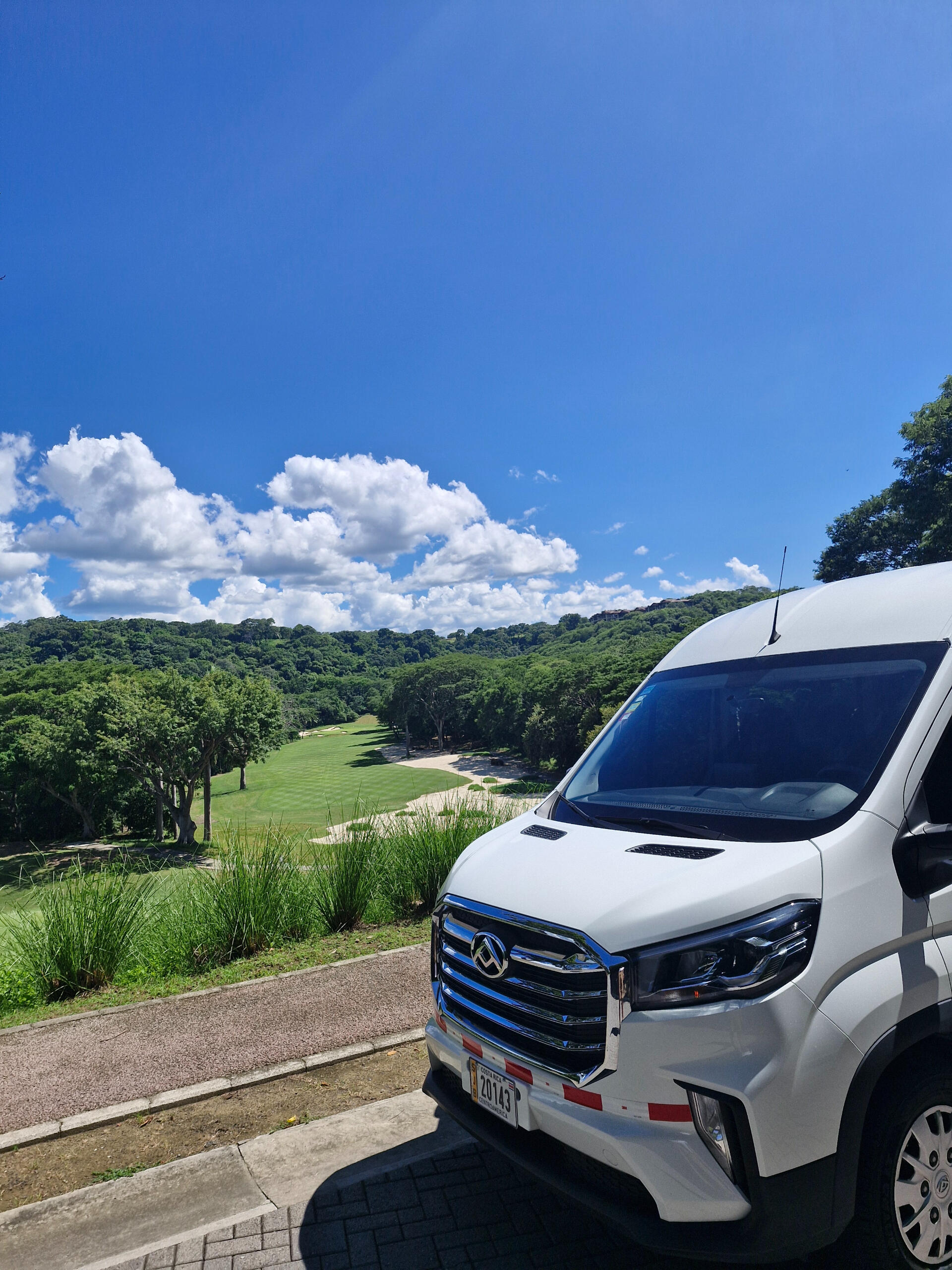 Passenger van and the golf course at Peninsula Papagayo Private Transportation. Nature and Wildlife in Costa Rica.